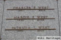 Charles E West