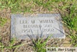 Lee M White