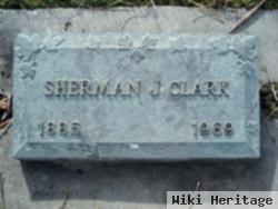 Sherman J Clark