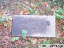 John P Scheck