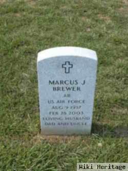 Marcus J Brewer