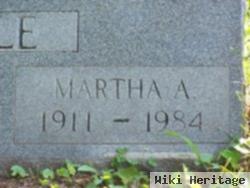 Martha E Courville