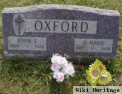 John E Oxford