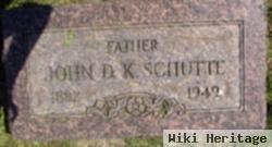 John D. K Schutte