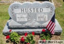 Daniel E Husted