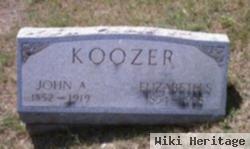 John A Koozer