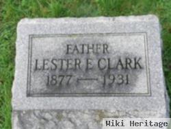 Lester E Clark