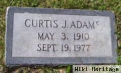 Curtis J Adams