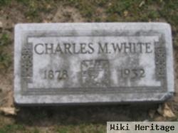 Charles M White