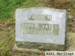 John M Yates