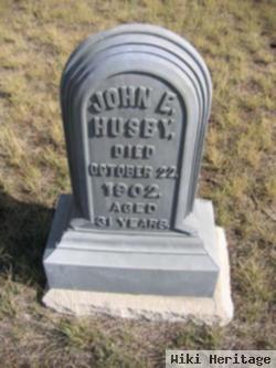 John E. Husby