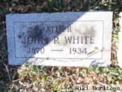 John P White