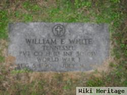 William E White