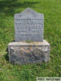 Nancy M Devine