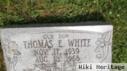 Thomas E White