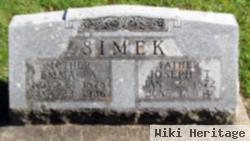 Joseph T Simek