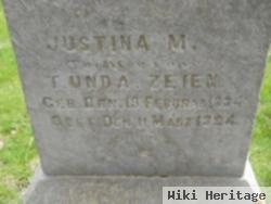 Justina M Zeien