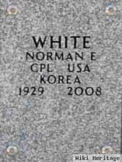 Norman E White