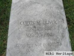 Curtis M Oliver