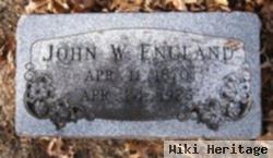 John W England