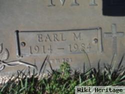 Earl M Mills