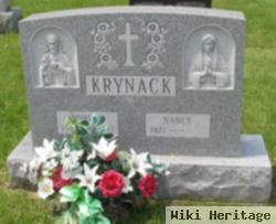 John J Krynack