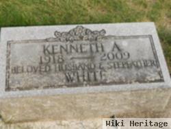 Kenneth A White