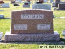 Maynard D Zolman