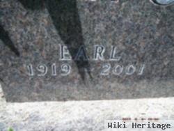 Earl E Holtz