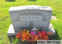 Maggie L. Settle