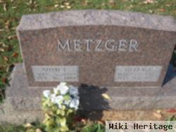 Adam C Metzger