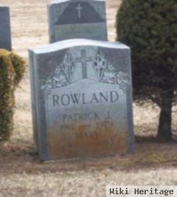 Patrick J Rowland