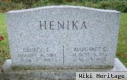 George E Henika