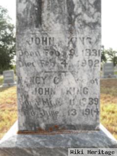 John M King