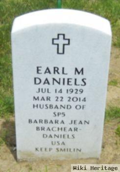 Earl M Daniels