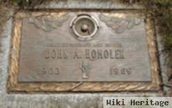 John A. Homolek