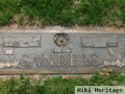 Lawrence E Sanders