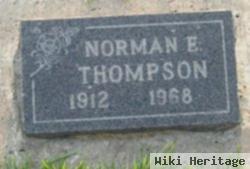 Norman E Thompson