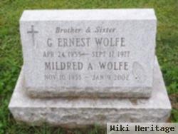 G Ernest Wolfe