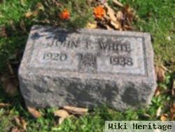 John F White