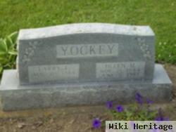 Larry E Yockey