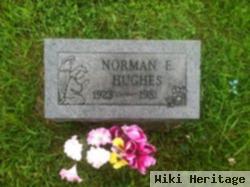 Norman E Hughes