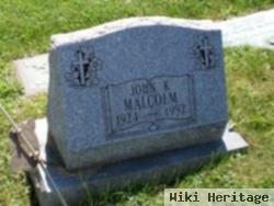 John K Malcom