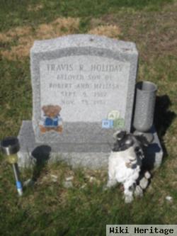 Travis R. Holliday