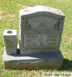 John L Sims