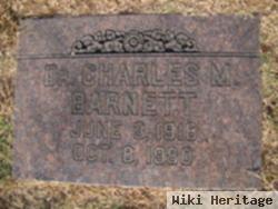 Dr Charles M Barnett