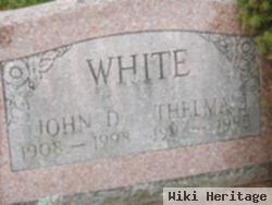 John D White