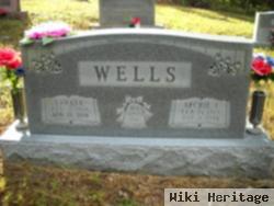 Archie L Wells