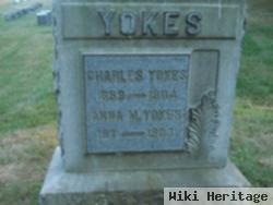 Charles E Yokes