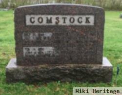 Lester J Comstock